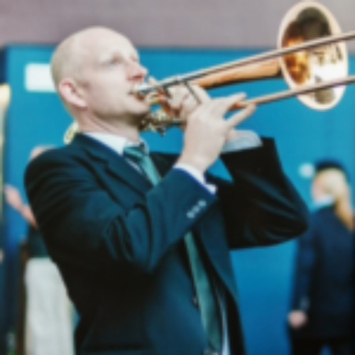 A man plays a trombone