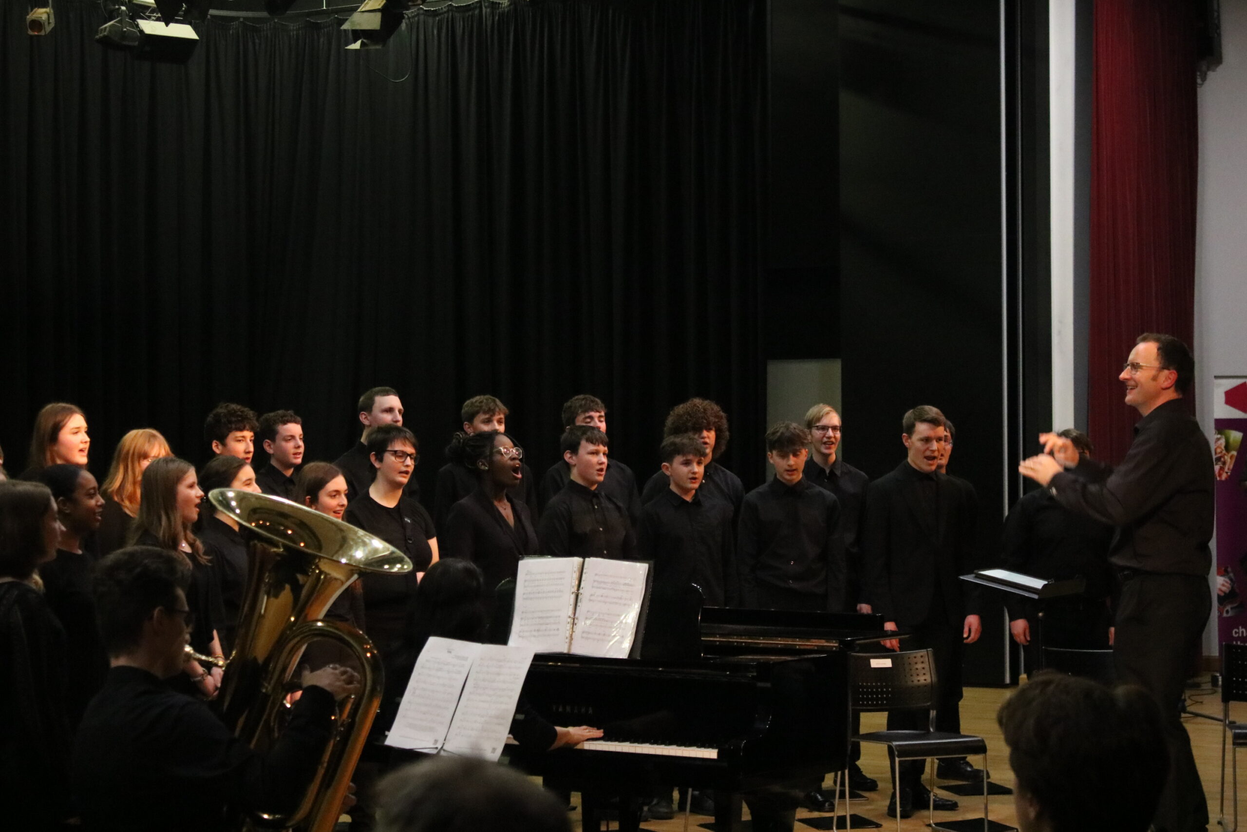 A Choir Dressed In Black Performs